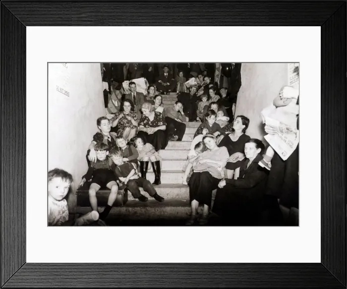 Framed Print : Families take cover from the Luftwaffe bombing of London in this disused London Framed Print : Families take cover from the Luftwaffe bombing of London in this disused London