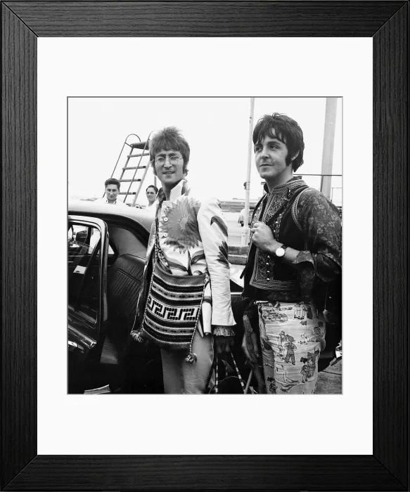 Framed Print : Paul McCartney and John Lennon arrive back in England from a Greek holiday July 1967 Framed Print : Paul McCartney and John Lennon arrive back in England from a Greek holiday July 1967