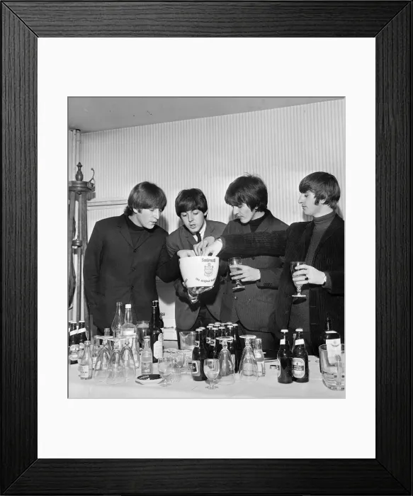 Framed Print : The Beatles helping themselves to drinks in hospitality area at a press reception Framed Print : The Beatles helping themselves to drinks in hospitality area at a press reception