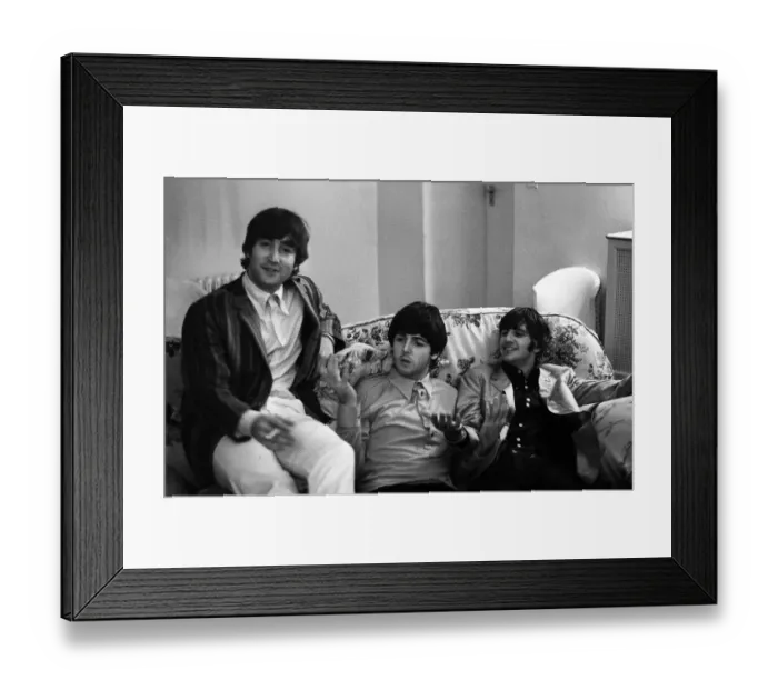 Framed Print : John Lennon, Paul McCartney and Ringo Starr of The Beatles relax in their room