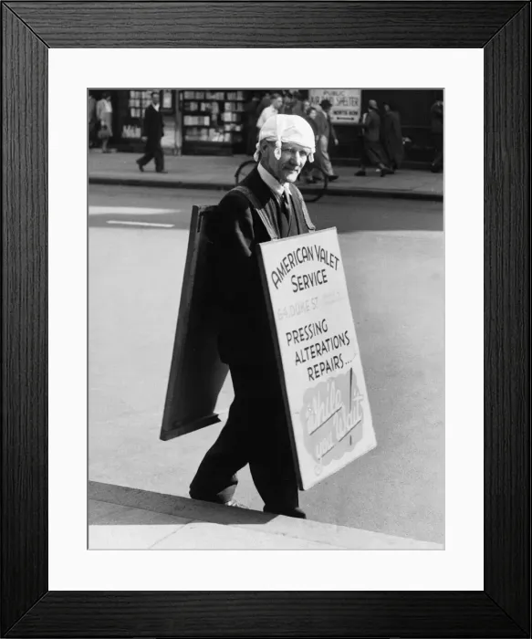 Framed Print : A man adverting an American Valet service walks down the road wearing a knotted Framed Print : A man adverting an American Valet service walks down the road wearing a knotted
