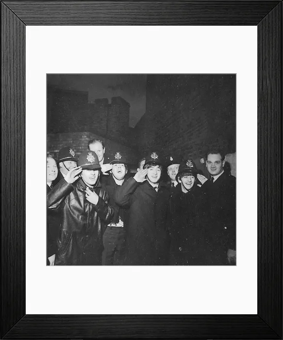 Framed Print : The Beatles clown dressed in policemen helmets used to smuggle them into the Birmingham