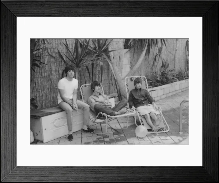 Framed Print : Beatles left to right: Paul McCartney, George Harrison and Ringo Starr relaxing in sun