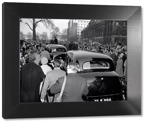 Sir Winston Churchill - April 1955, people gather as the cars go by
