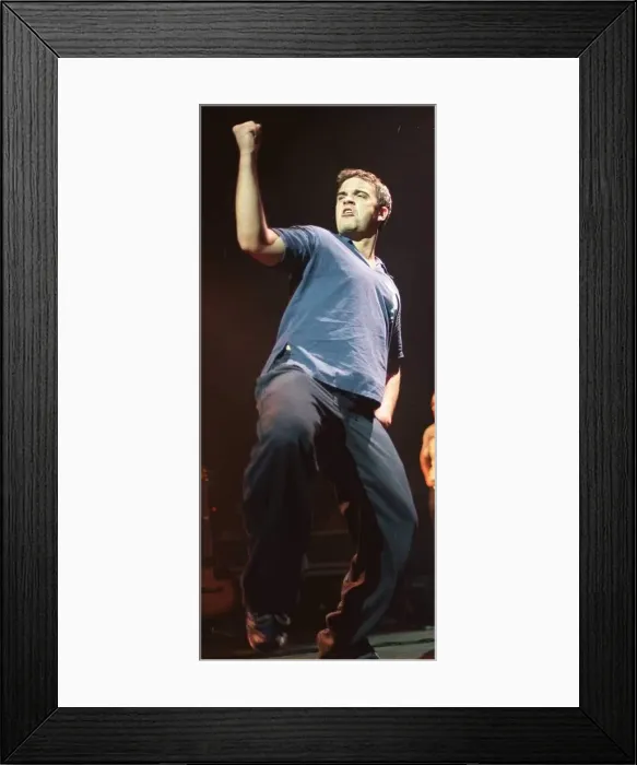 Framed Print : Robbie Williams shakes his fist at his concert at the SECC Glasgow February 1999 Framed Print : Robbie Williams shakes his fist at his concert at the SECC Glasgow February 1999