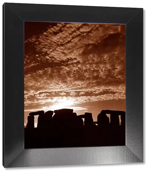 Sunset over Stonehenge in Wiltshire Britain Sunset Silhouette Clouds