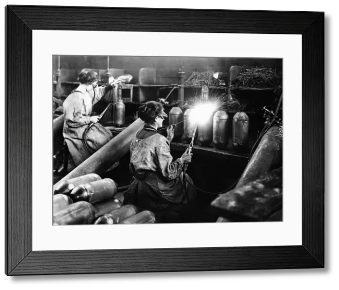 Framed Print : Women munition workers at munition factory, manufacturing bombs. March 1916 Framed Print : Women munition workers at munition factory, manufacturing bombs. March 1916