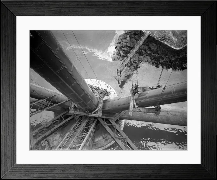 Framed Print : Workmen preparing a platform around one of the girders of the Forth rail Bridge prior to