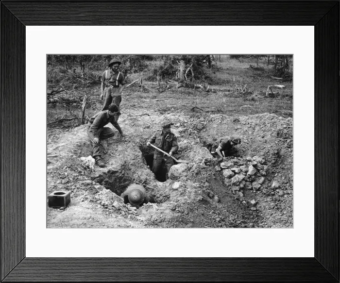 : British soldiers dig defences at the village of Hottot near Tilly Surseulles. WW2 1944 : British soldiers dig defences at the village of Hottot near Tilly Surseulles. WW2 1944