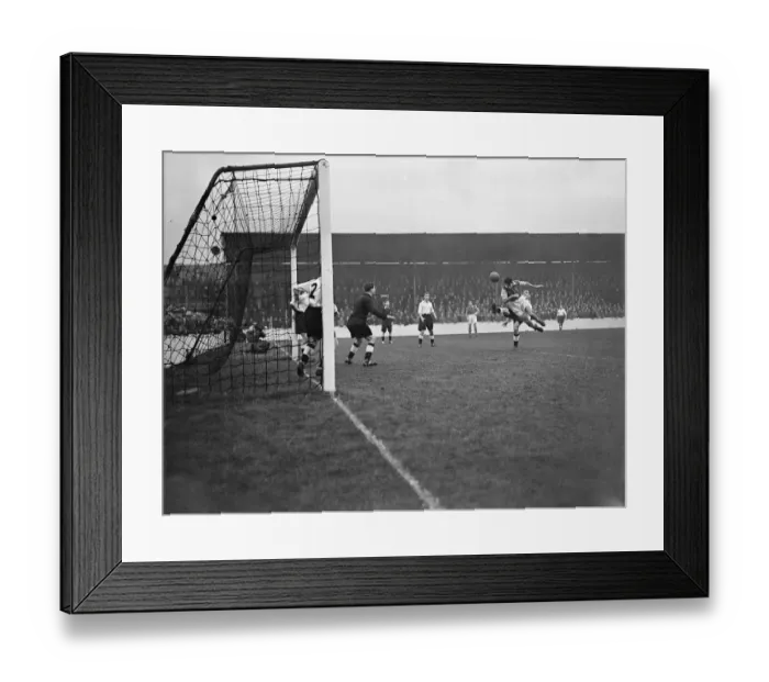 Framed Print : Division Two West Ham v Swansea. West Ham striker attempting a header on the Swansea goal