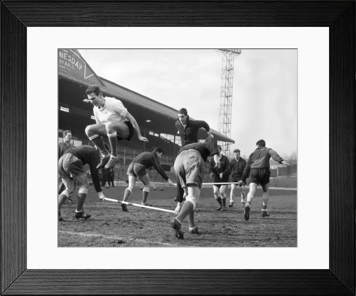 Framed Print : Sheffield Wednesday football players pictured jumping over poles during a training