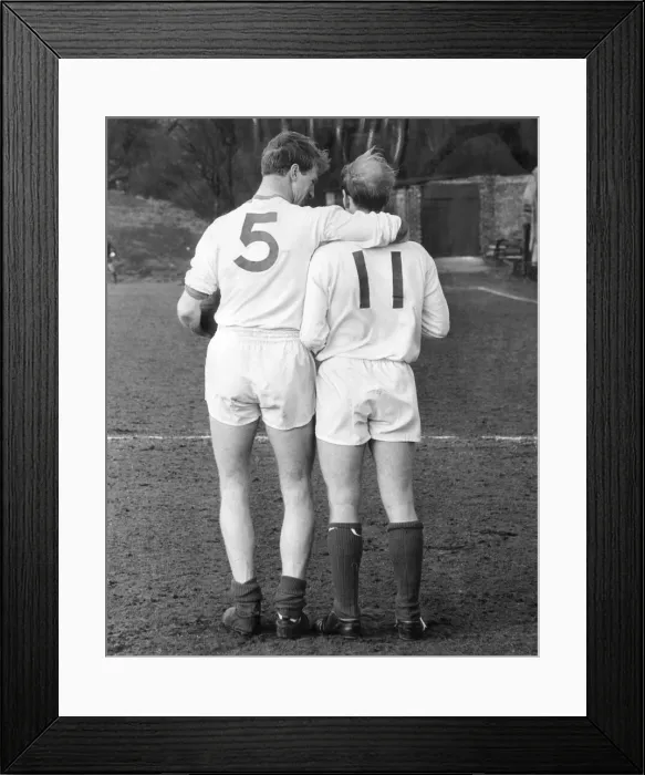 Framed Print : England football brothers Jack (left) and Bobby Charlton during a training session with Framed Print : England football brothers Jack (left) and Bobby Charlton during a training session with