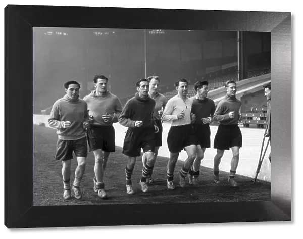 Manchester City football players pictured during training session as they jog around
