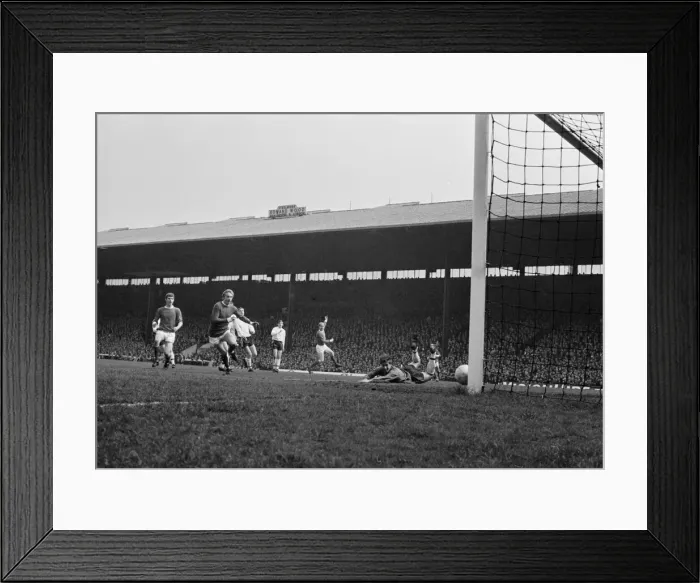 Framed Print : Manchester United forward Bobby charlton raises his arm in celebration after scoring a