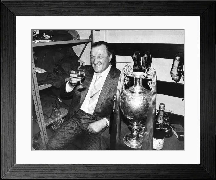 Framed Print : Liverpool manager Bob Paisley celebrates with a glass of champagne in the dressing room Framed Print : Liverpool manager Bob Paisley celebrates with a glass of champagne in the dressing room