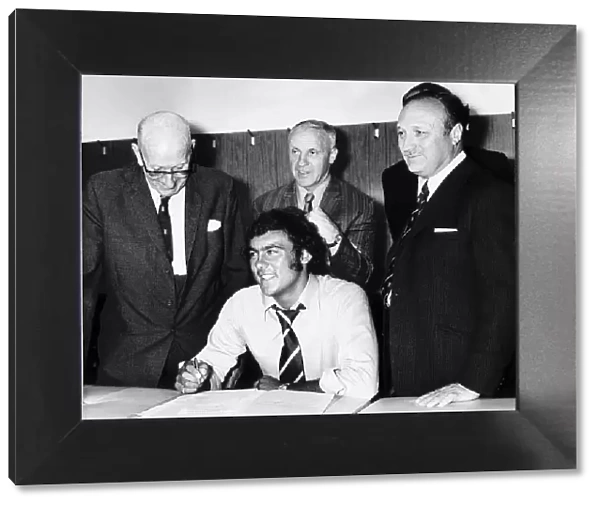 Ray Kennedy signs for Liverpool Football Club with manager Bill Shankly