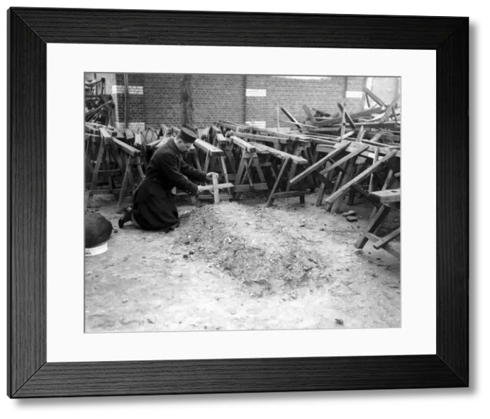 Framed Print : This Belgian soldier was given the job of making wooden crosses to mark the graves of his Framed Print : This Belgian soldier was given the job of making wooden crosses to mark the graves of his