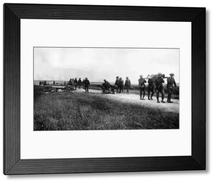 Framed Print : British soldiers collecting wounded from Front Line France 1916 Shellfire in