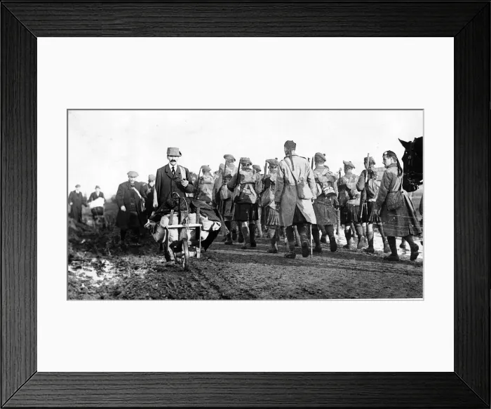 Framed Print : World War One - Canadian kilties march at Mons passing French civilians 1918
