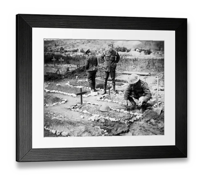 Framed Print : An army chaplain tending to a British soldiers grave in 1916 in France after the Battle