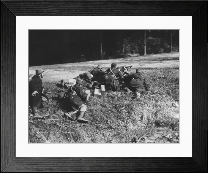Framed Print : World War One - Belgian soldiers man a machine gun on the edge of a road as part of