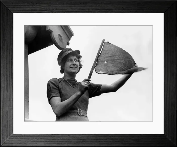 Framed Print : Mrs Village an LNER railway worker signals to a train during WW2. 1941 Framed Print : Mrs Village an LNER railway worker signals to a train during WW2. 1941