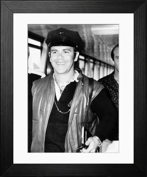 Framed Print : Singer, Elton John, arriving at London Airport from Nice. 29th July 1980 Framed Print : Singer, Elton John, arriving at London Airport from Nice. 29th July 1980