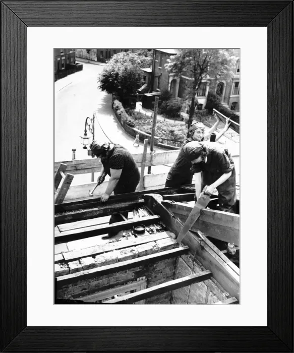Framed Print : Women take over the job of building houses - 1941 during WW2