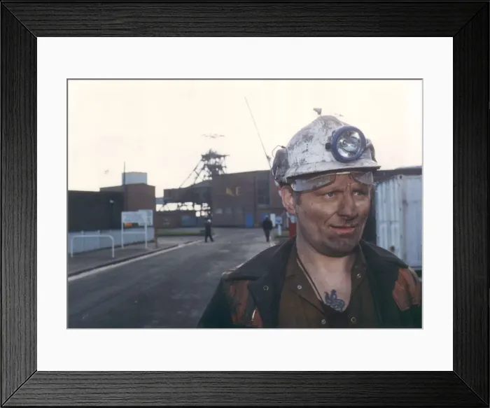 Framed Print : A miner at the entrance to Ellington Colliery with the Big E Framed Print : A miner at the entrance to Ellington Colliery with the Big E