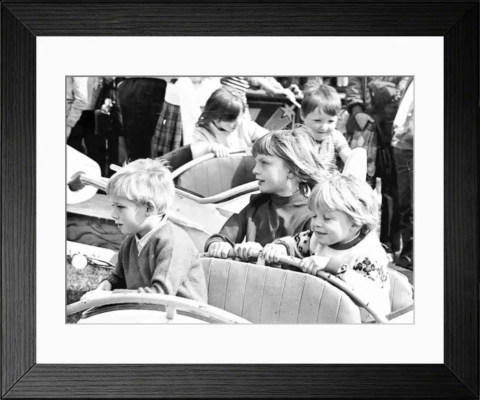 Framed Print : Some youngsters enjoy a small white knuckle ride, at least it is to them Framed Print : Some youngsters enjoy a small white knuckle ride, at least it is to them