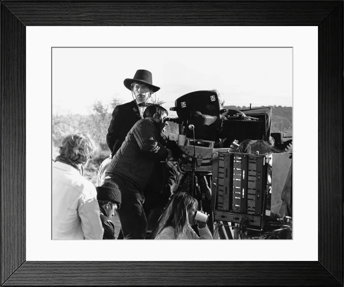 Framed Print : Rolling Stones Mick Jagger as Ned Kelly looks on as the crew prepare to shoot the next Framed Print : Rolling Stones Mick Jagger as Ned Kelly looks on as the crew prepare to shoot the next
