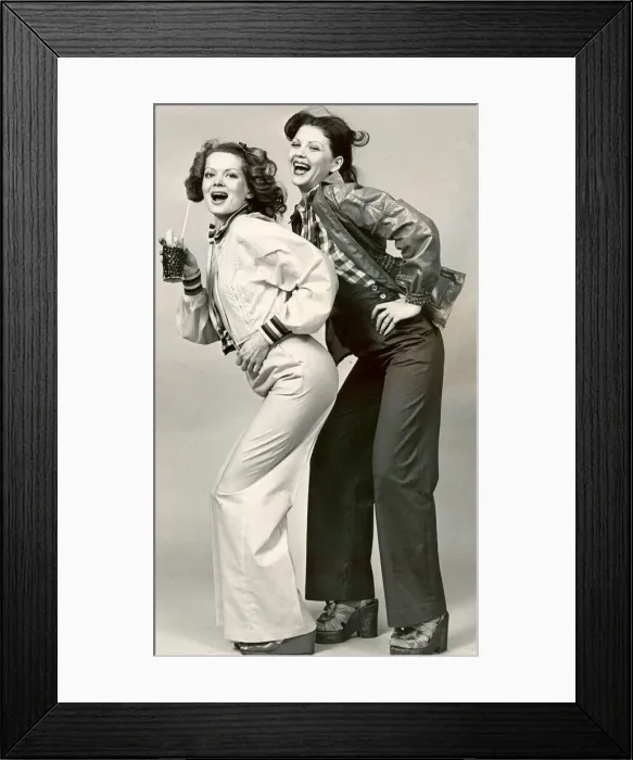 Framed Print : Two girls modelling waterproof jackets Framed Print : Two girls modelling waterproof jackets
