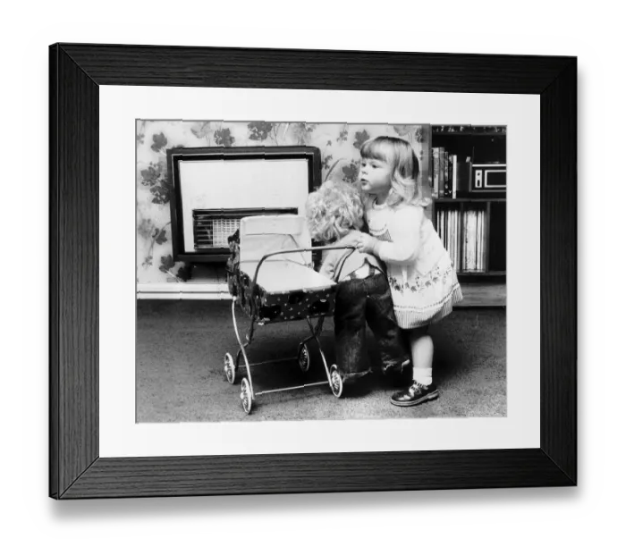 Framed Print : Louise Brown Test Tube Girl playing with doll and dolls pram June 1980 Framed Print : Louise Brown Test Tube Girl playing with doll and dolls pram June 1980