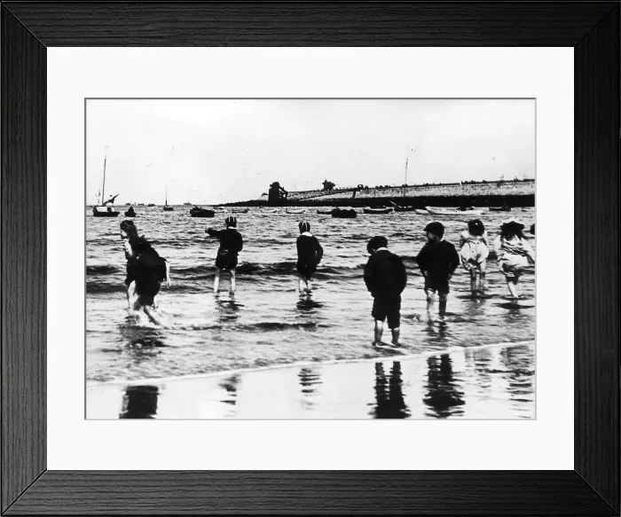 Framed Print : Youngsters paddling in the sea