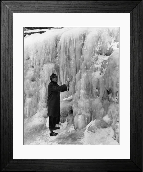 Framed Print : This man, who is over six feet tall, was photographed against one of the frozen Framed Print : This man, who is over six feet tall, was photographed against one of the frozen