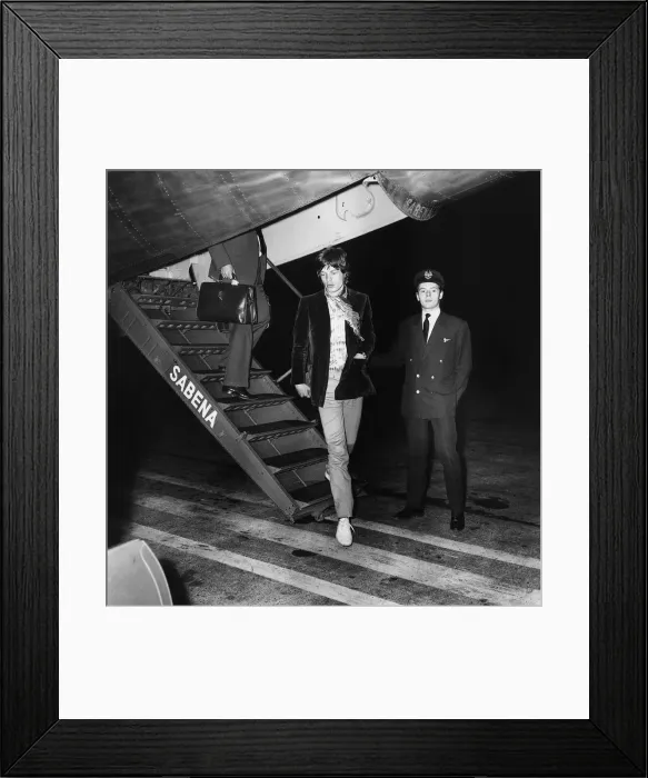 Framed Print : Rolling Stones: Mick Jagger disembarks at Heathrow Airport from his flight home Framed Print : Rolling Stones: Mick Jagger disembarks at Heathrow Airport from his flight home