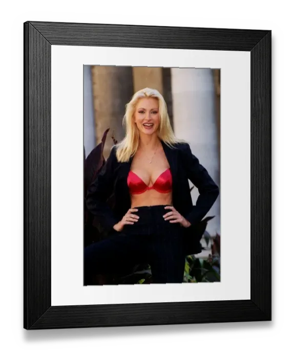  : Caprice shows the new Berry Satin Wonderbra and a Navy Pinstripe suit by French