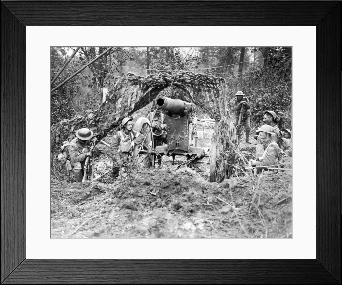 Framed Print : Canadian soldiers rest beside a captured German gun. The Germans blew away Framed Print : Canadian soldiers rest beside a captured German gun. The Germans blew away