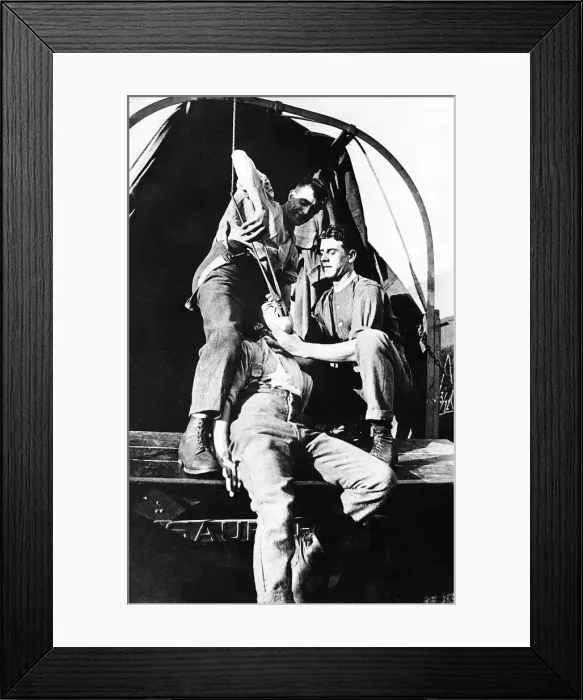 Framed Print : World War One soldier has a tooth extracted 1917 using a large pair of tongs Framed Print : World War One soldier has a tooth extracted 1917 using a large pair of tongs