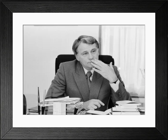 Framed Print : England manager Bobby Robson sitting at his busy desk as he gets prepared for his