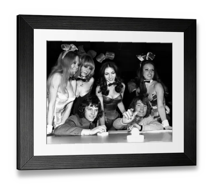 Framed Print : Footballer Mick Shannon (left) playing Rodney Marsh at air hockey at The Playboy Club in