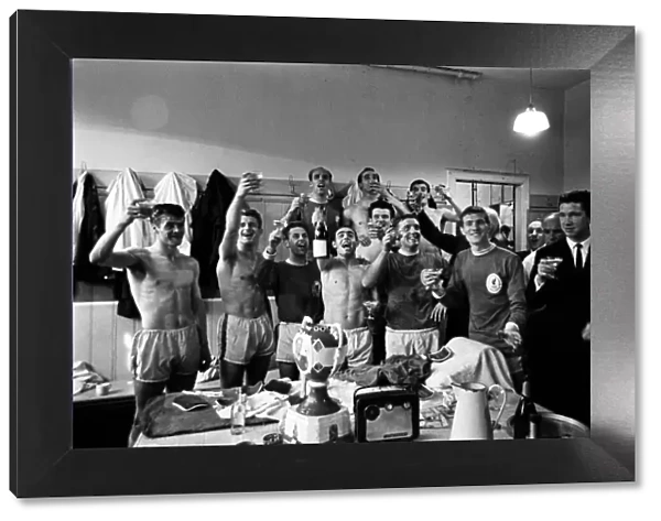 Liverpool players celebrate in the dressing room after beating Arsenal 5-0 to win