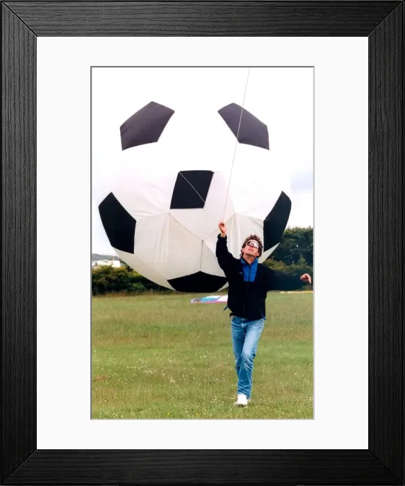 Framed Print : A participant in the annual kite festival at Washington in July 1996 Framed Print : A participant in the annual kite festival at Washington in July 1996