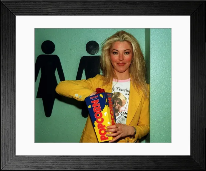 Framed Print : Tamara Beckwith model eating popcorn at film premiere circa May 1997