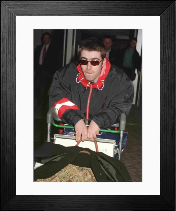Framed Print : Liam Gallagher of the pop group Oasis arriving at Heathrow from Paris