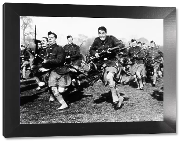 Scottish soldiers practise bayonet charging during World War One