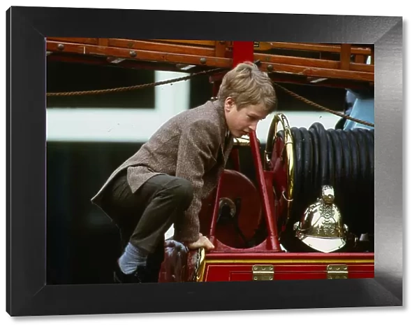 Peter Phillips January 1988 son of Princess Anne scrambles over top of old fire
