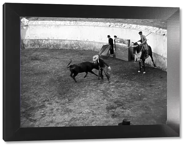 A man riding horse during a bullfight in Seville, Andalusia Circa 1935
