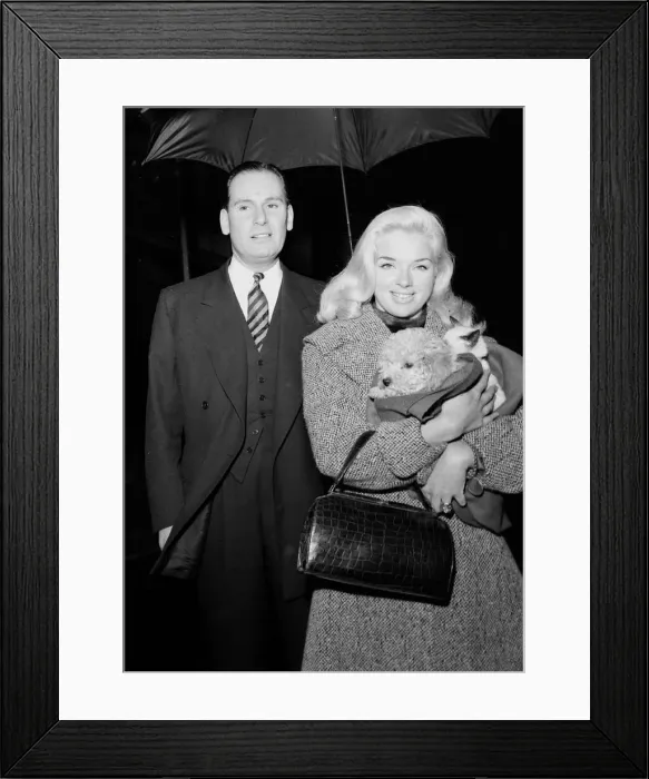 Framed Print : Actress Diana Dors holding her pets as she arrives at court on assault charges