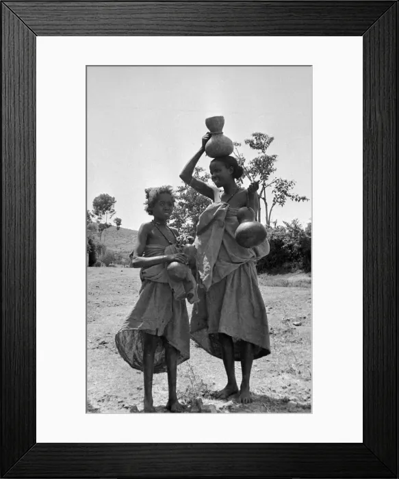 Framed Print : Children carrying water jars on the banks of the Nile near to Cairo Circa 1935 Framed Print : Children carrying water jars on the banks of the Nile near to Cairo Circa 1935